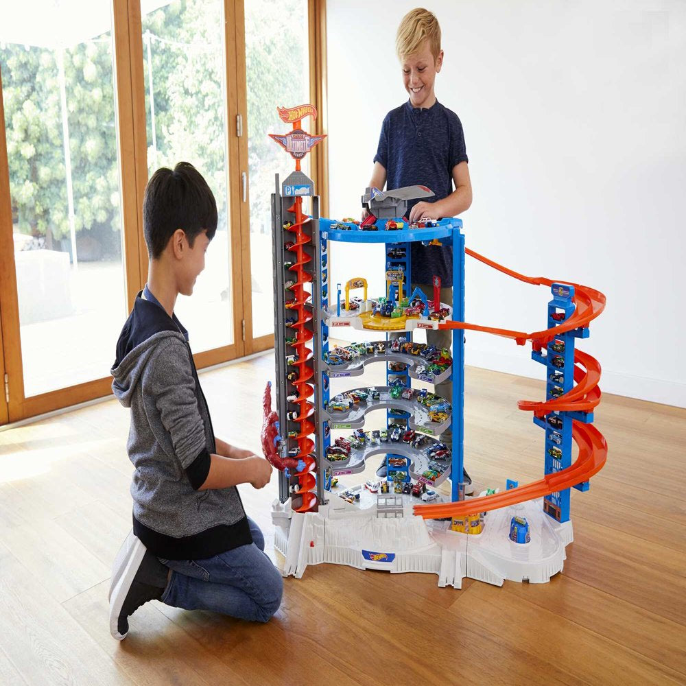 Hot Wheels Track Set with 4 1:64 Scale Toy Cars, Super Ultimate Garage, Over 3 Feet Tall